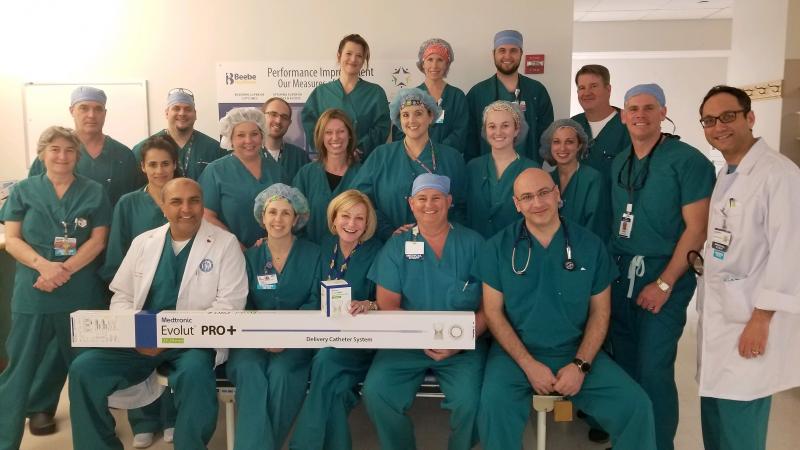 Beebe TAVR group members shown are in back (l-r) Melania Schultz, Medtronic representative; April Connor, CVOR, robotic cardiac coordinator; Matthew Brown, SPD tech; and Paul Mahoney. In the third row are Ted Stephenson, MD; Kyle Schlezes, cardiac cath tech; and Matthew Emerick, invasive cardiology nurse manager. In the second row are Karen Doctor, lead echo tech; Mariam Katching; Amy Bradshaw, lead cath tech; April King, echocardiographer; Kimberly Potter, CVOR surgical technologist; Katie Dukes, CVOR nurse; Jillian Dashiell, MD; Kirby Kaufman, Medtronic representative; and Armin Barekatain, MD. In front are Ehtasham Qureshi, MD; Tina Gland, team lead, operating room; Mary Frances Suter, executive director of Beebe cardiac and vascular services; Brian McCarthy, PA-C, Beebe cardiothoracic surgery; and Mouhanad Freih, MD. SUBMITTED PHOTO